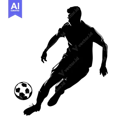 Silhouette of a soccer player kicking a ball