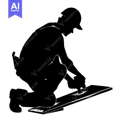 Silhouette of a construction worker kneeling and working on a roof