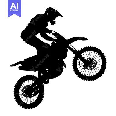 Silhouette of a Motocross Rider Performing a Wheelie