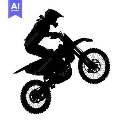 Silhouette of a Motocross Rider Performing a Wheelie