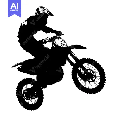 Silhouette of a motocross rider mid-air on a dirt bike