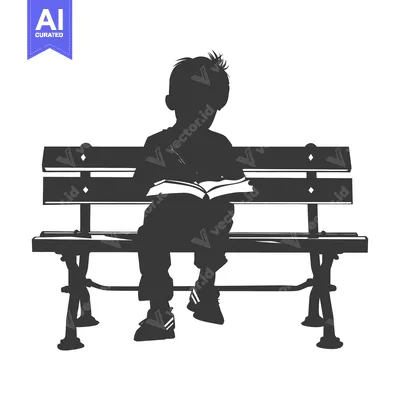 Silhouette of a Boy Reading on a Bench