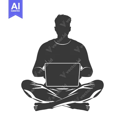 Silhouette of a Man Sitting in Lotus Position Using a Laptop