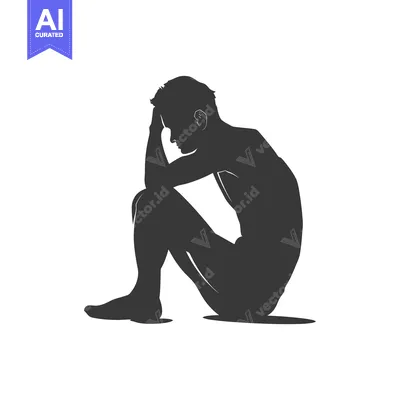 Silhouette of a Man Sitting with His Head in His Hands