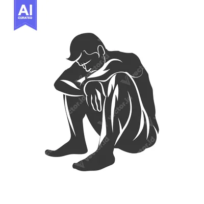 Silhouette of a man sitting with his head in his hands