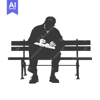 Silhouette of a Man Writing on a Bench