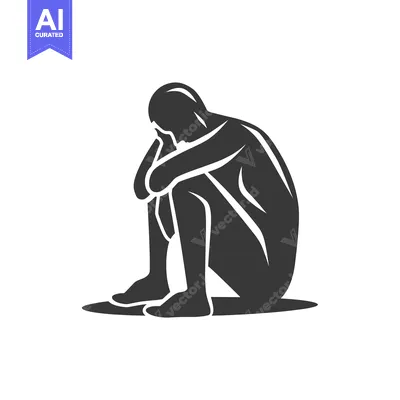 Silhouette of a Person Sitting with Head in Hands