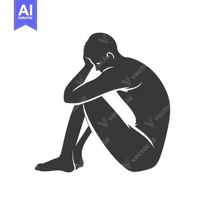 Silhouette of a person sitting with their head in their hands.